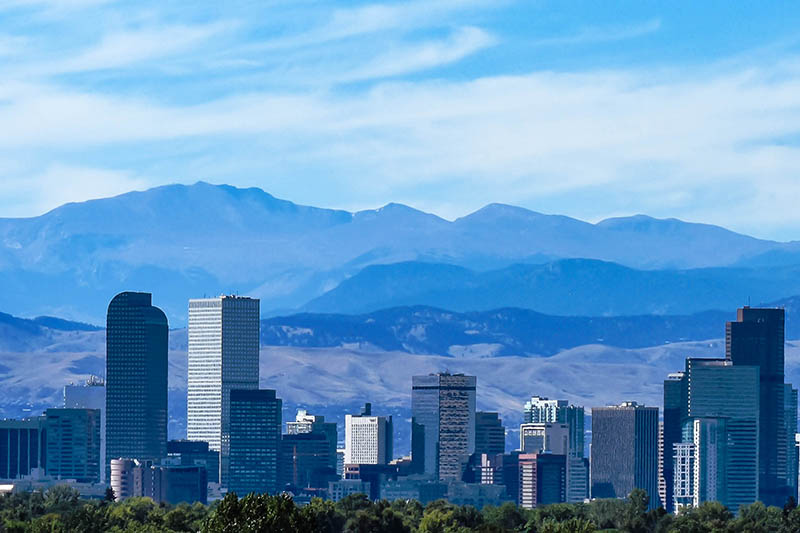 Denver skyline with mountain range in background